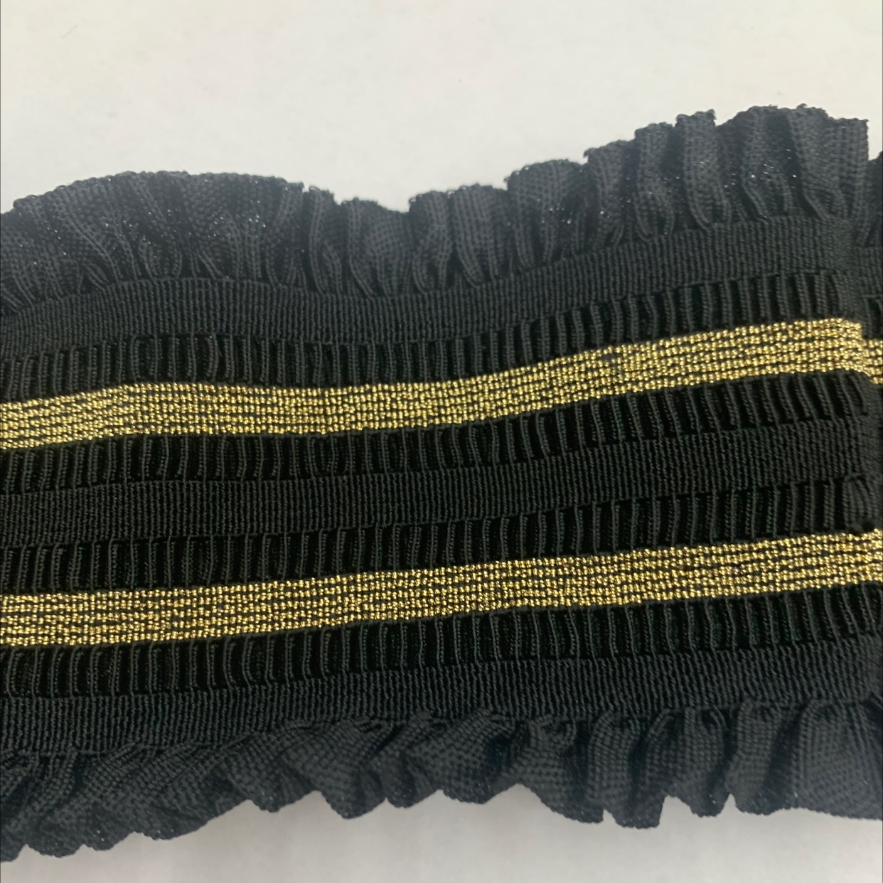 The lace is loose and tight with gold threads
