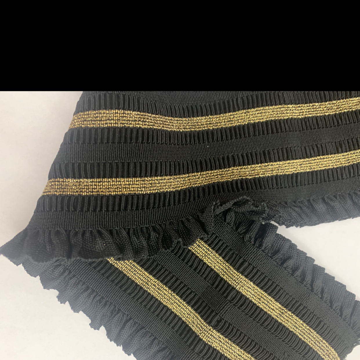 The lace is loose and tight with gold threads details Picture