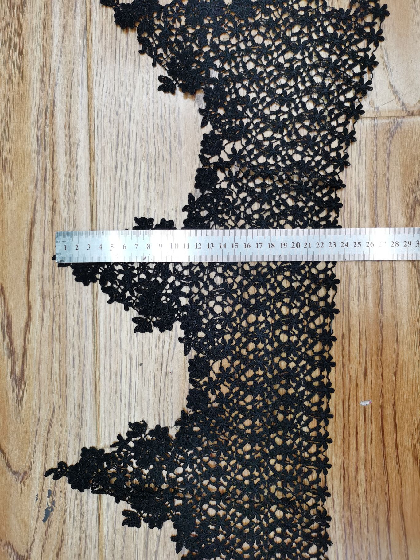 The headwear of the clothing is decorated with wide barcode lace detail image 2