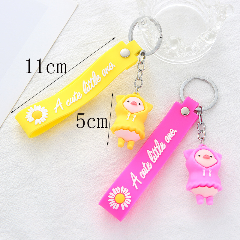New PVC creative and cute cartoon raincoat pig keychain pendant, fashionable and trendy couple key chain accessory detail image 3