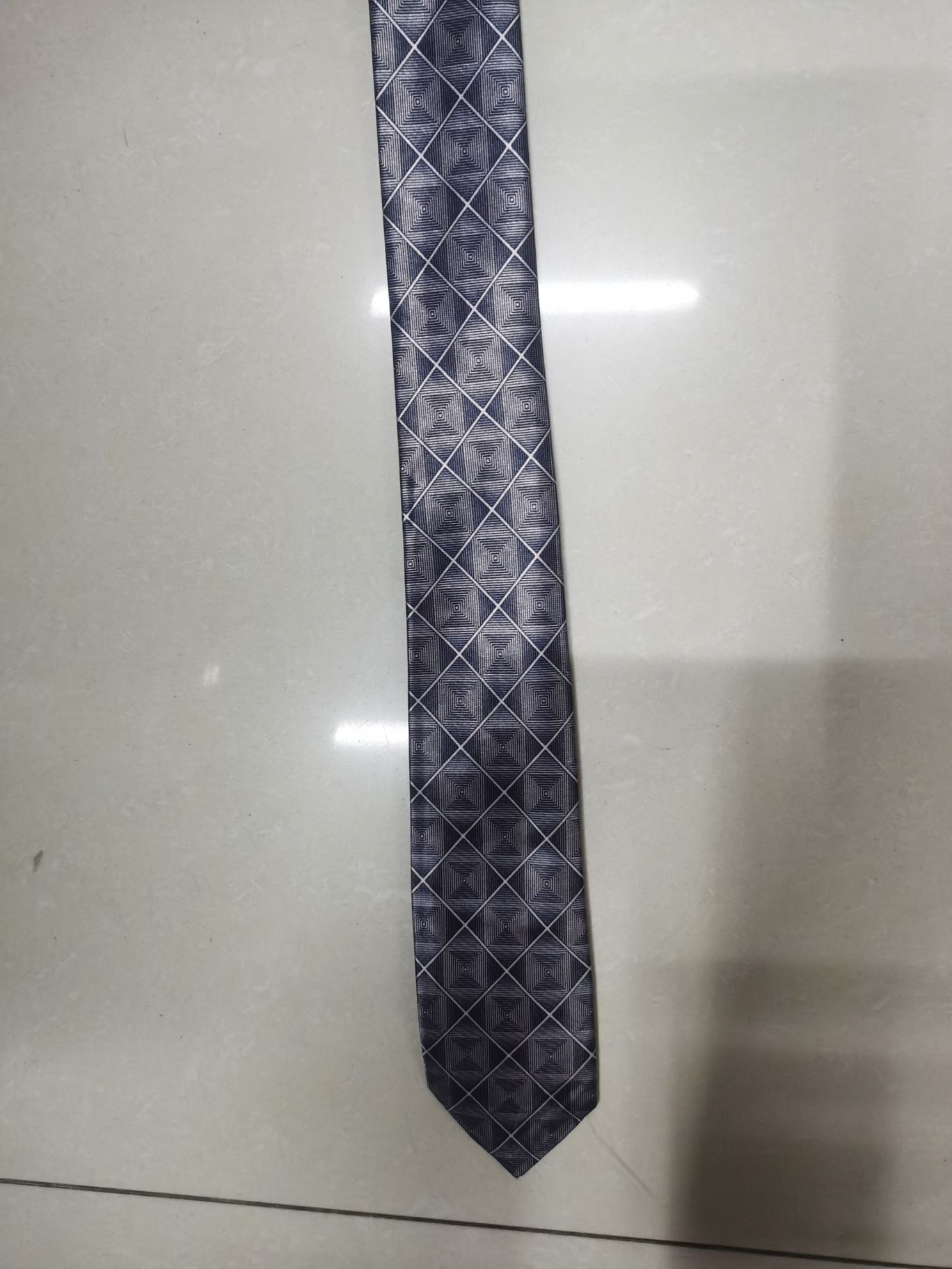 A grey tie with chemical fiber transfer printing details Picture