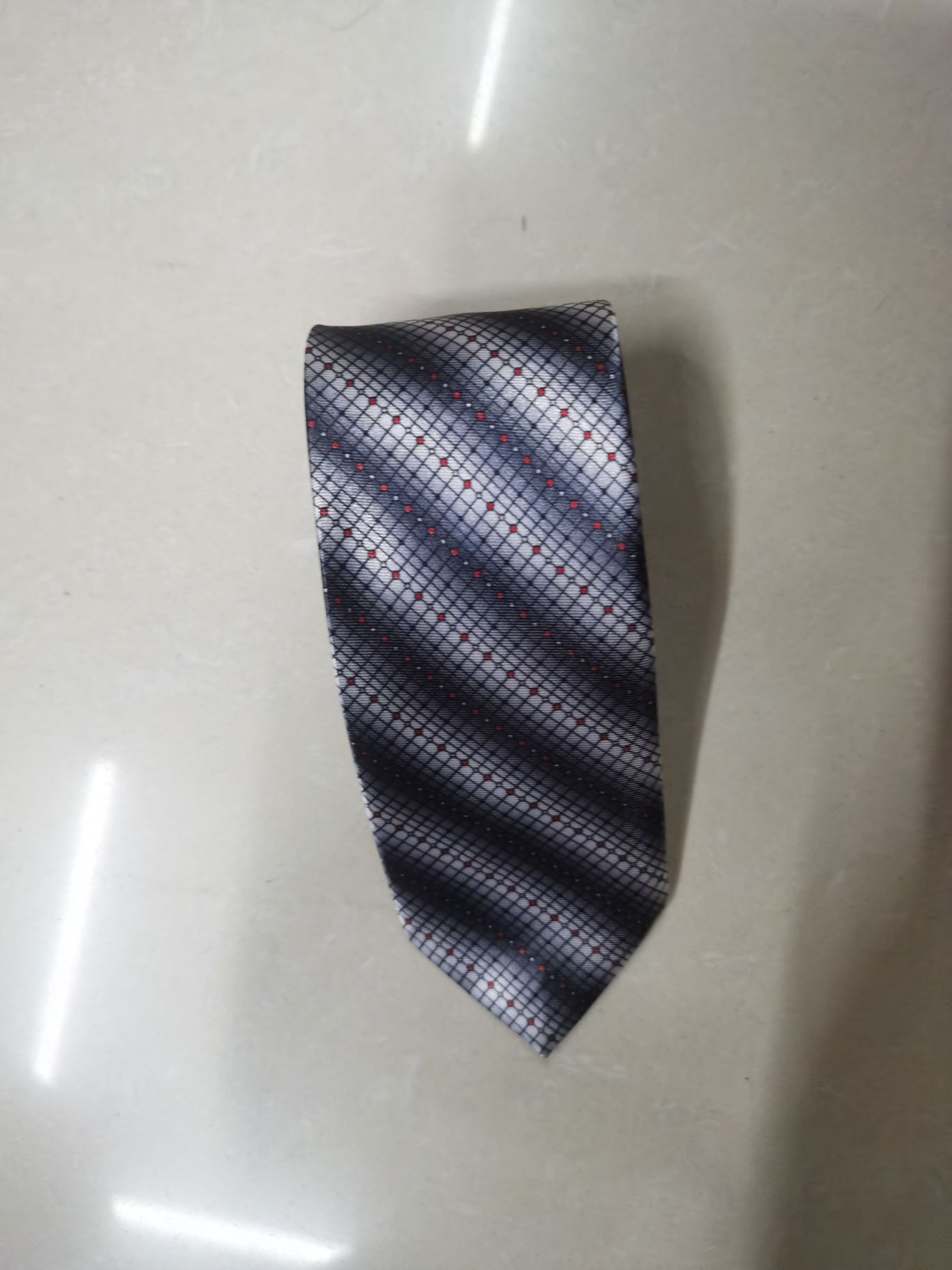 A grey tie with chemical fiber transfer printing Specification image