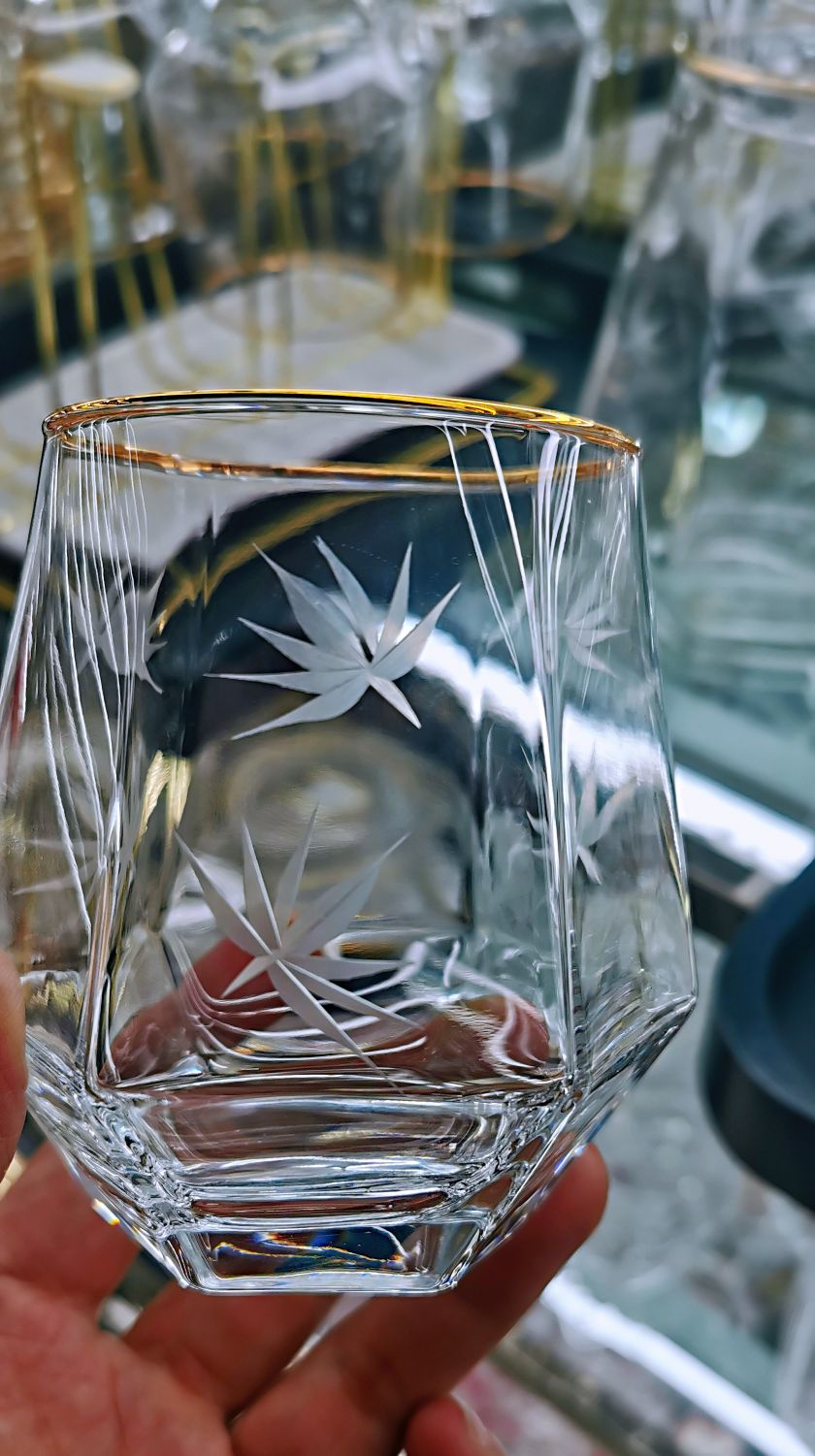 Artisan crafting hand-painted glassware
