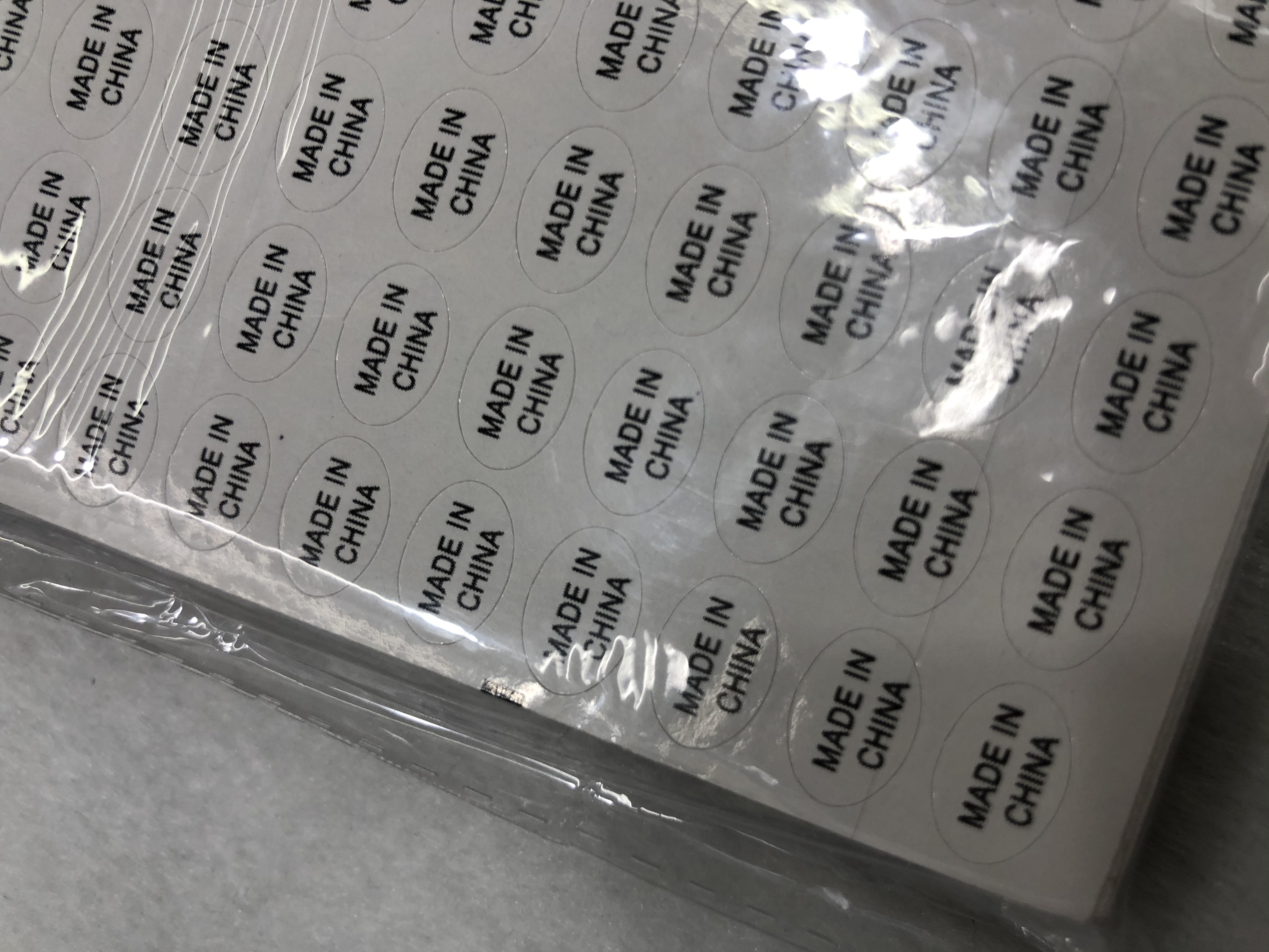 1.1*0.8白底黑字圆形不干胶印刷中国制造标签详情图4