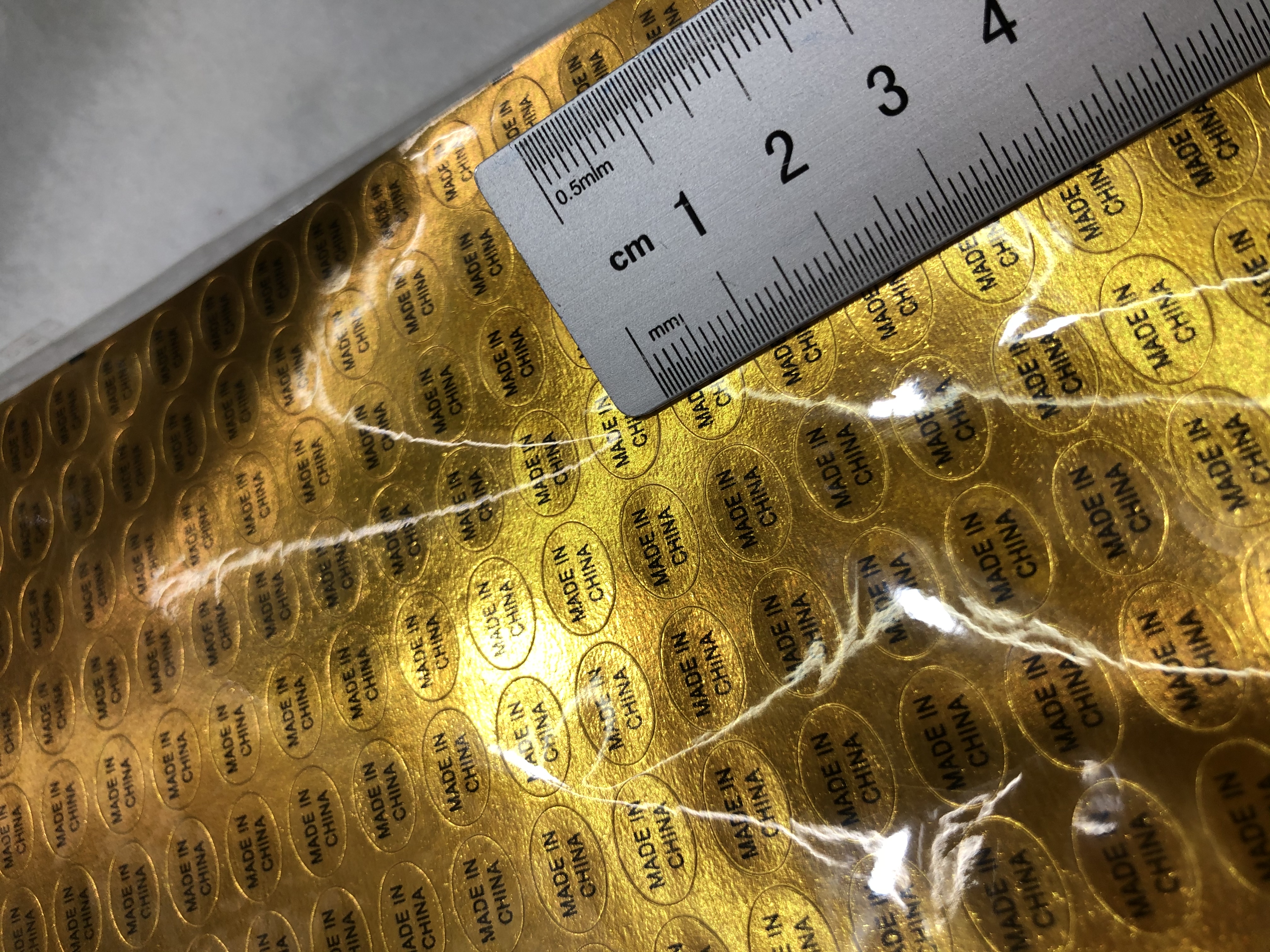 圆形金色不干胶金底黑字印刷1.2*0.8细节图