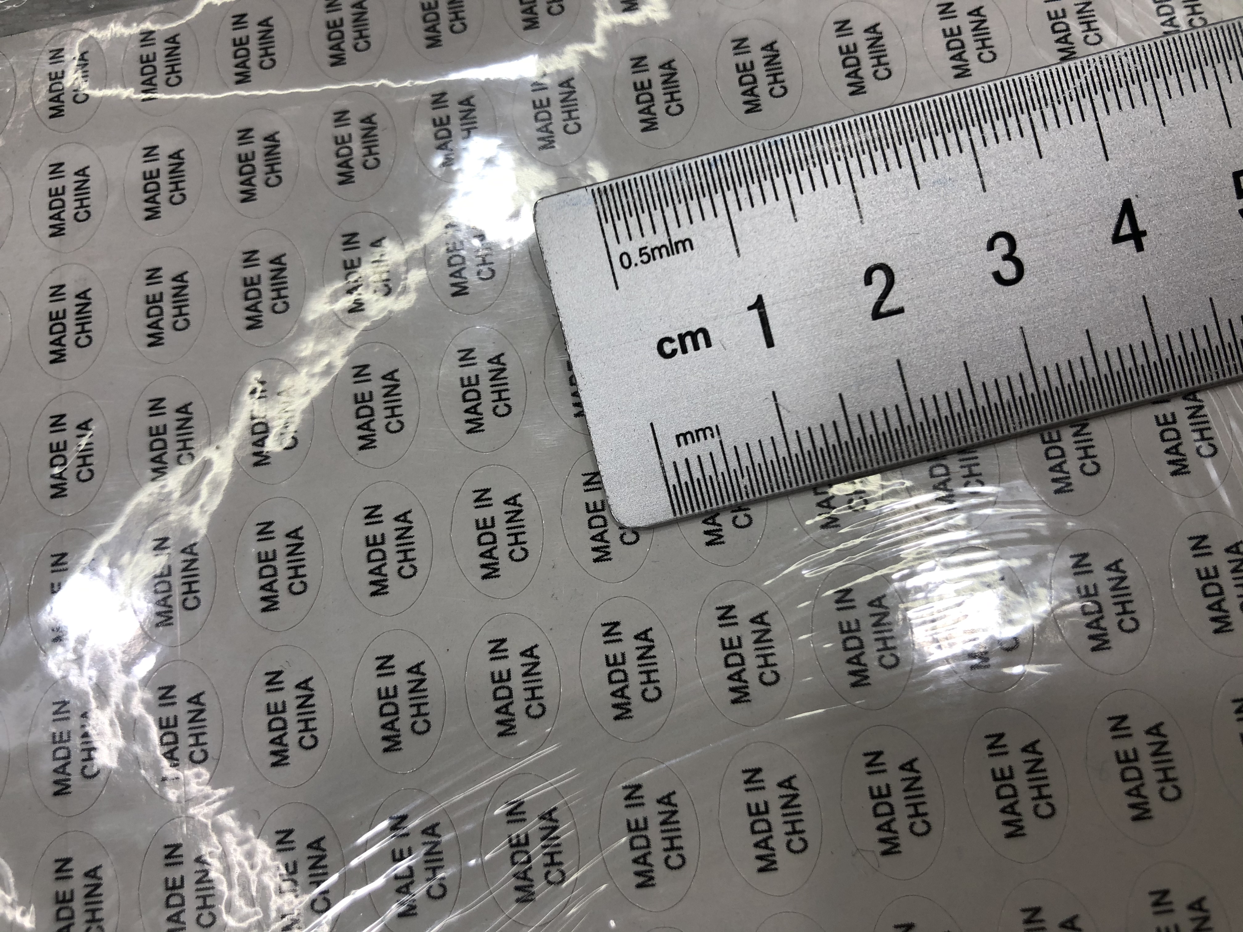 1.1*0.8白底黑字圆形不干胶印刷中国制造标签详情图3