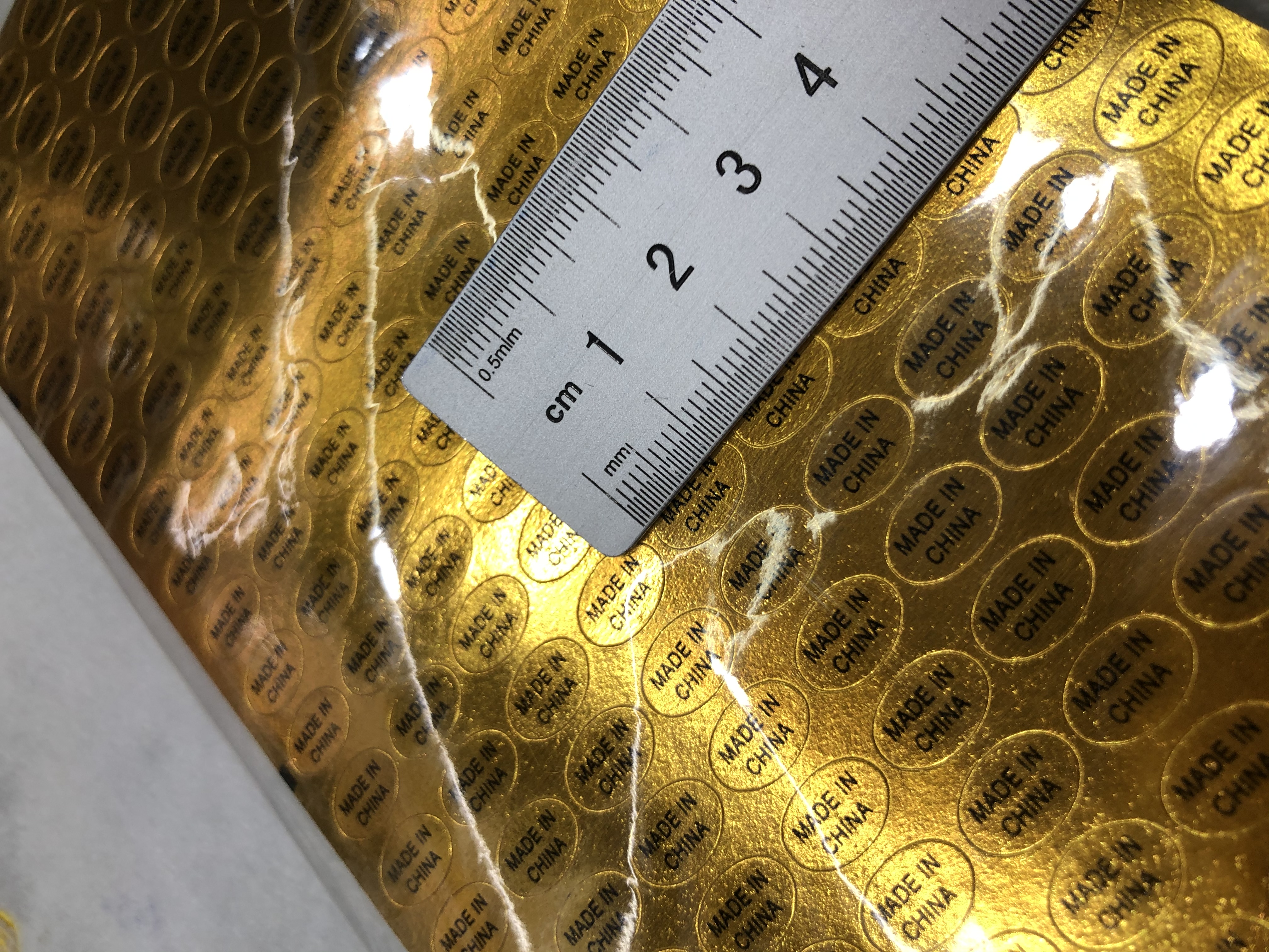 圆形金色不干胶金底黑字印刷1.2*0.8产品图