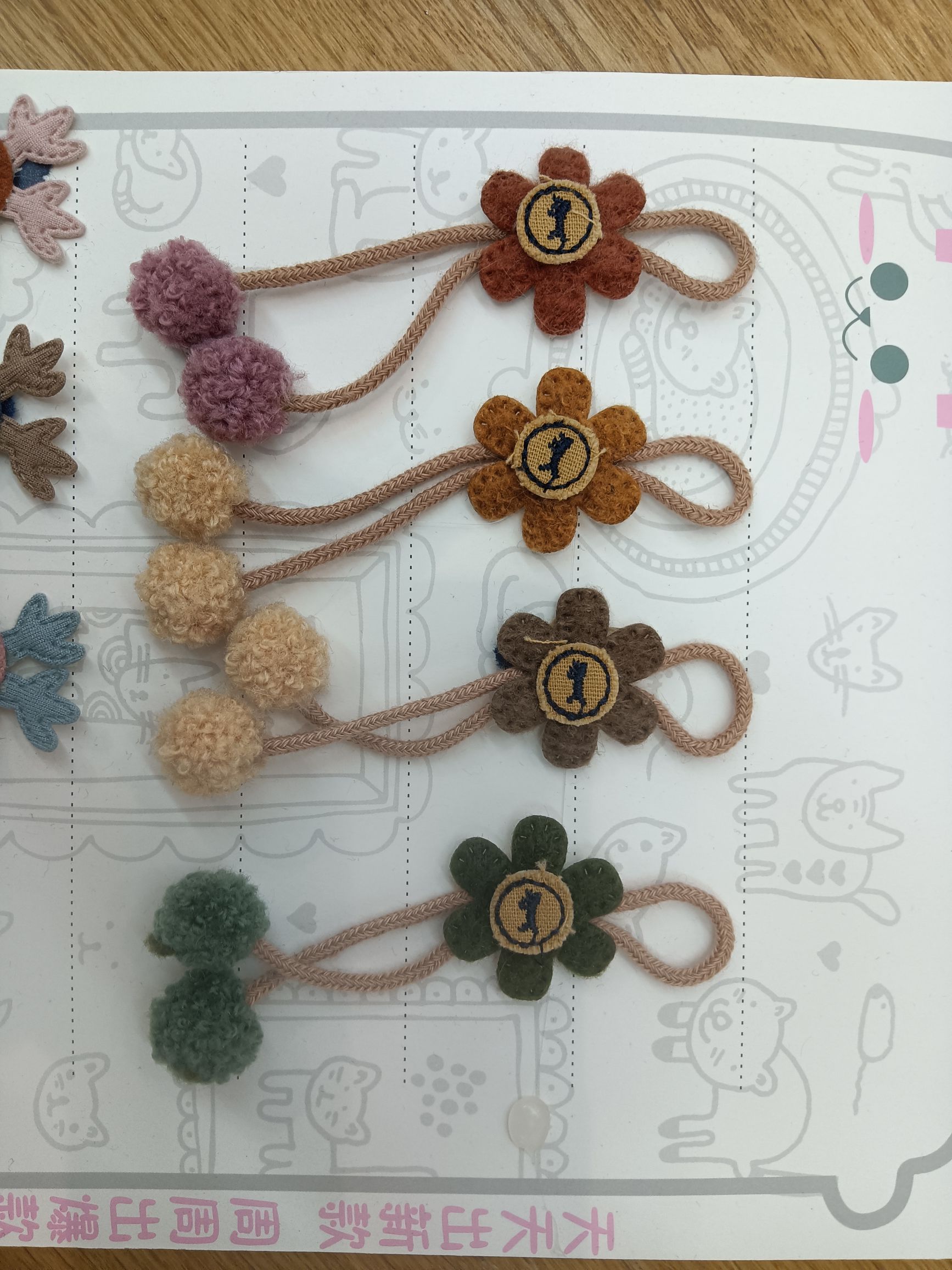 Little flower hangs on double balls detail image 1