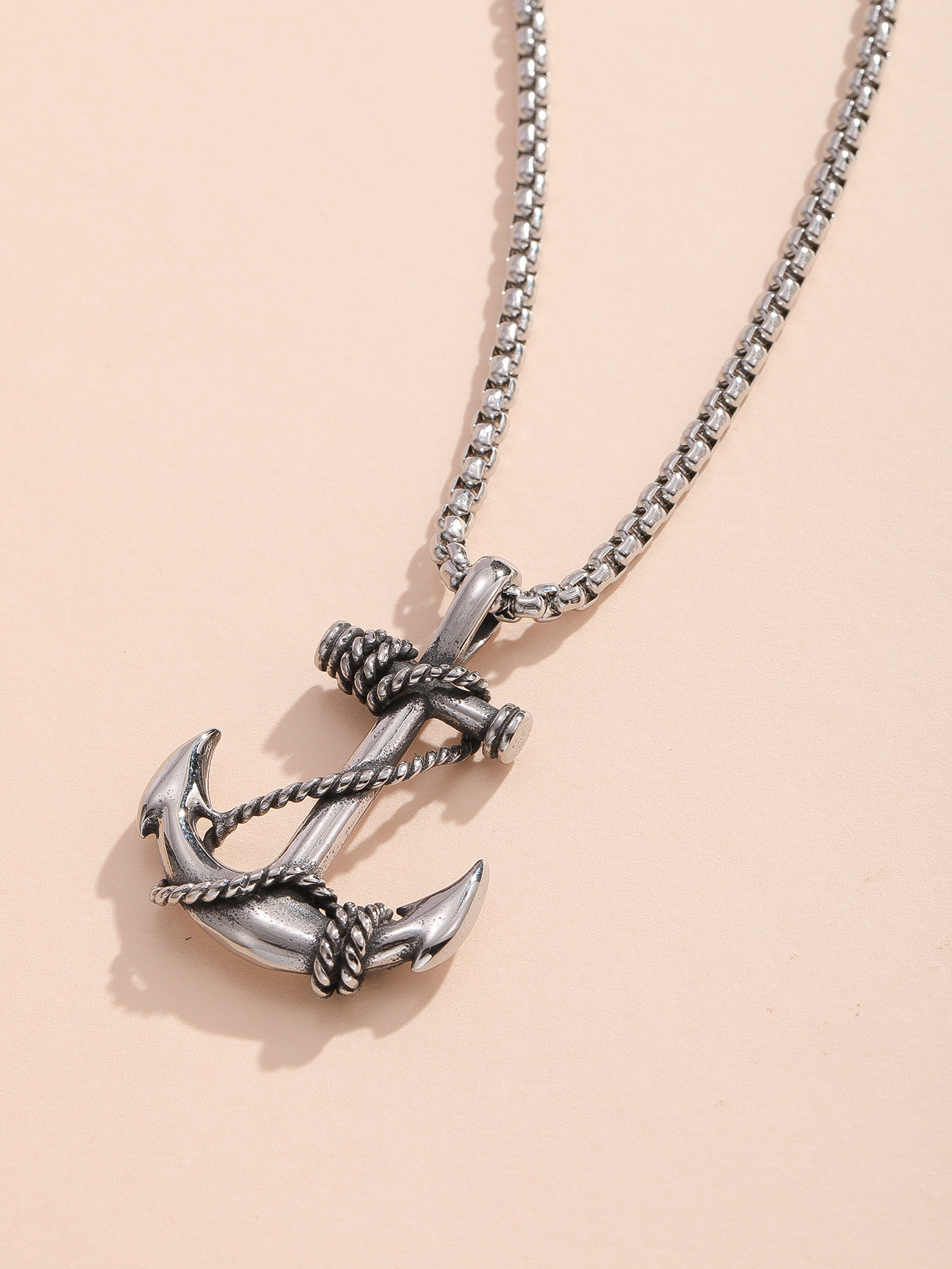 A stainless steel pendant necklace with pirate ship anchor details Picture