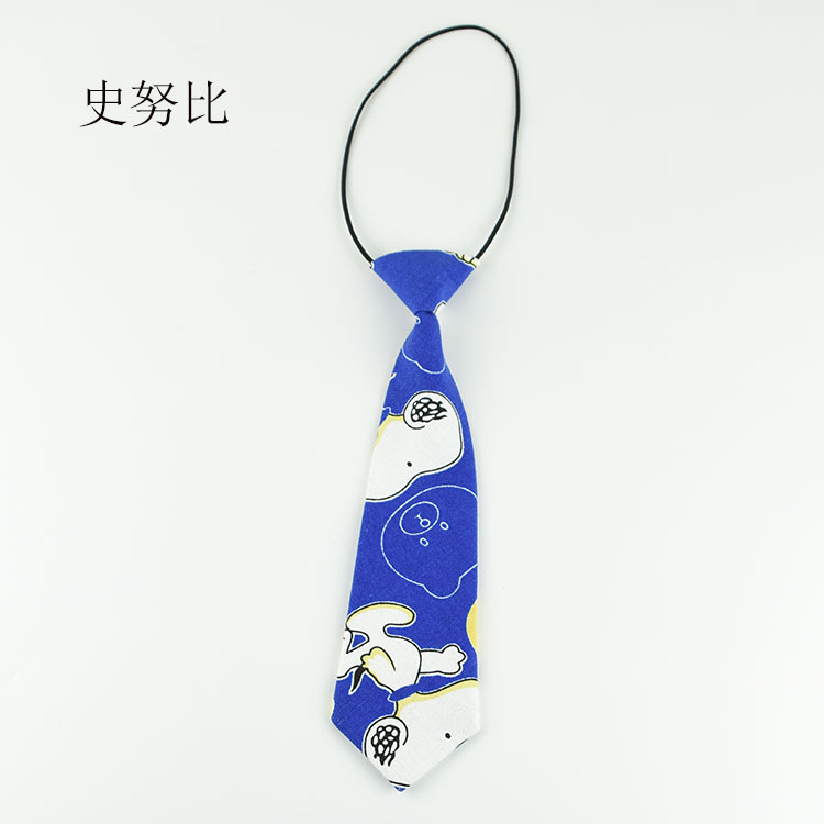 A woman with a small tie pairs it with a creative and fun cartoon canvas tie details Picture