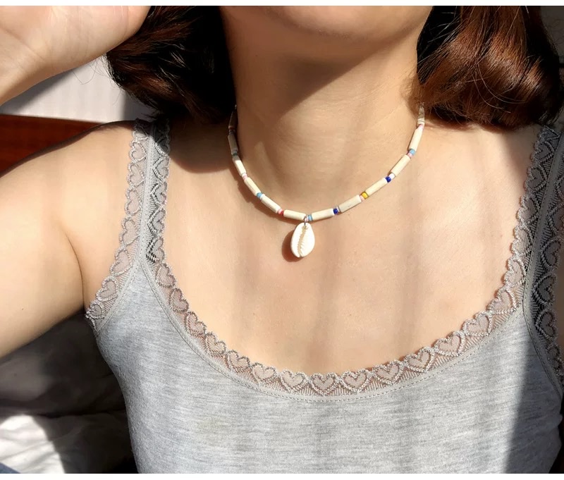 A long-shaped wooden beaded shell necklace