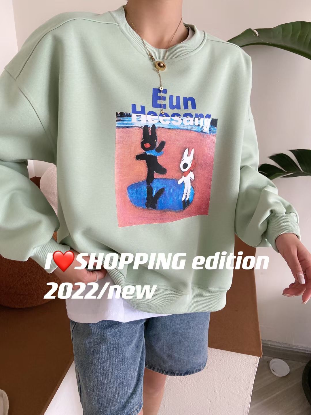 A new style of loose women's hoodie with cartoon print design detail image 5