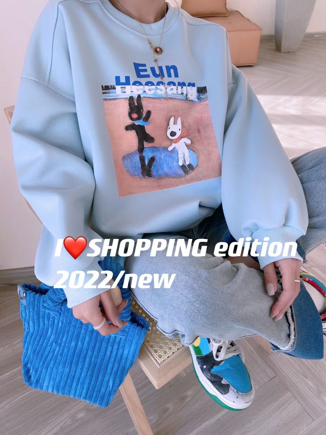 A new style of loose women's hoodie with cartoon print design detail image 3