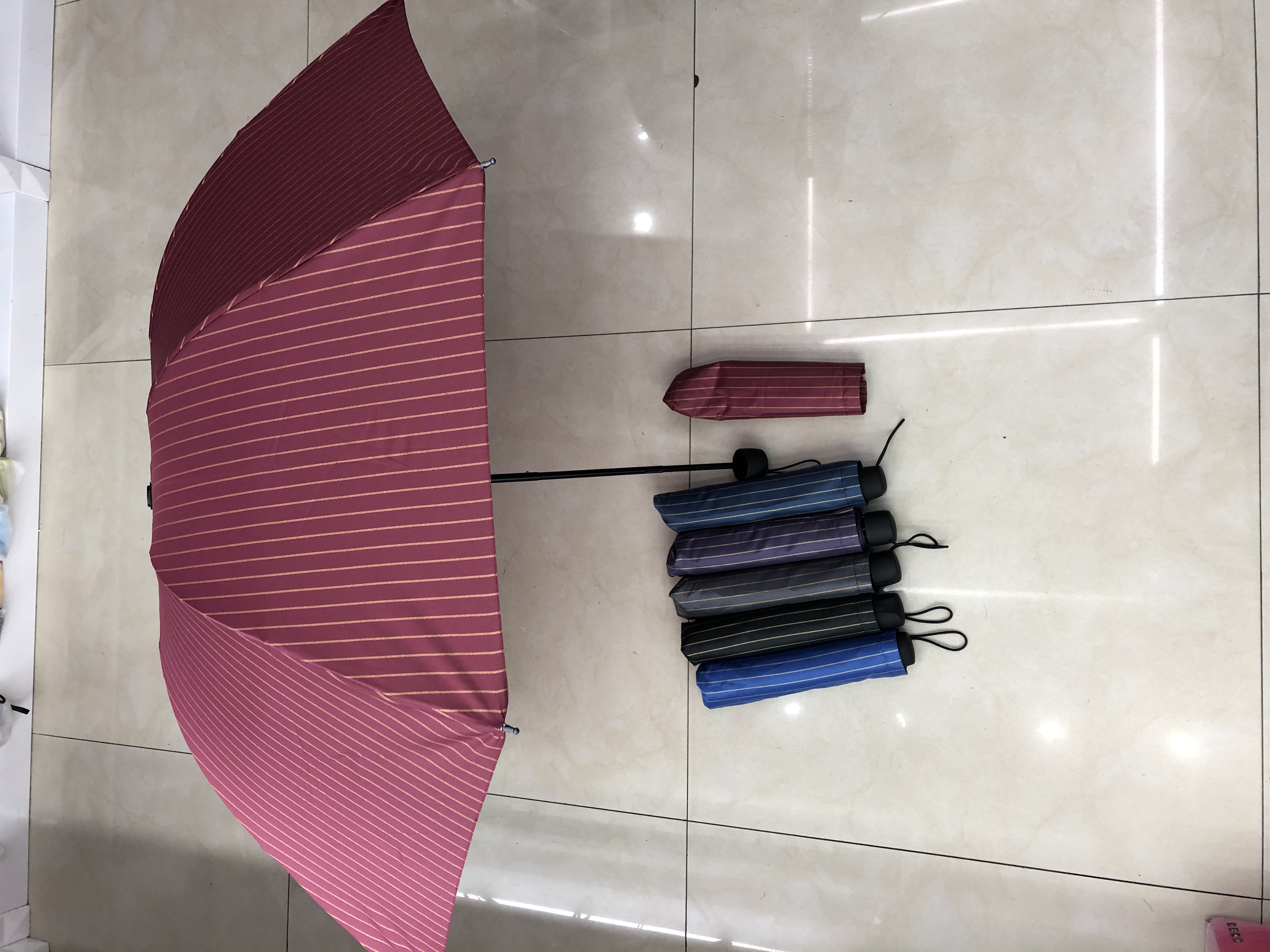 Three-fold spray-painted fabric striped umbrella details Picture