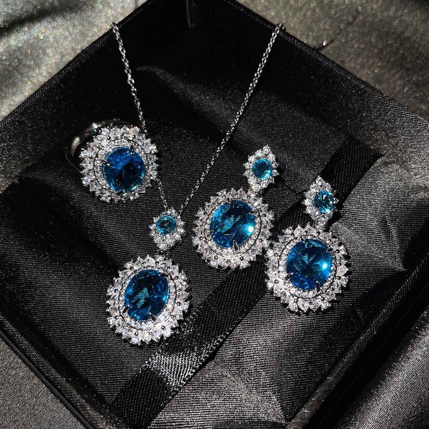 A new luxury set from Europe and America, set with a sea-blue topaz ring, yellow crystal earrings and a pink diamond necklace