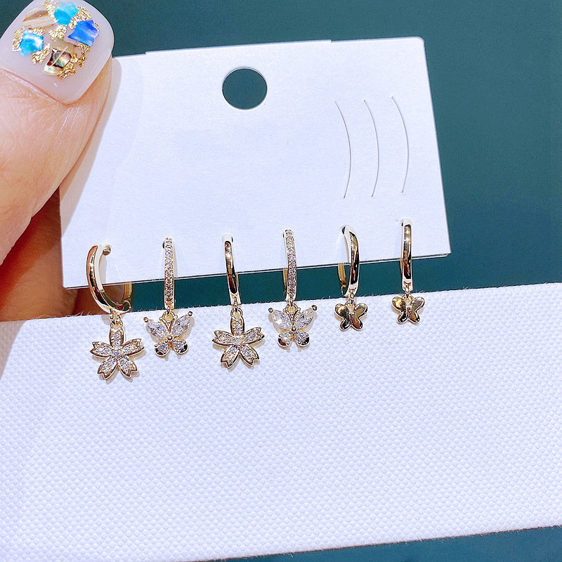 A new cross-border European and American earring set, featuring exquisite and fashionable zircon flower butterfly ear loops and ear rings in three pairs