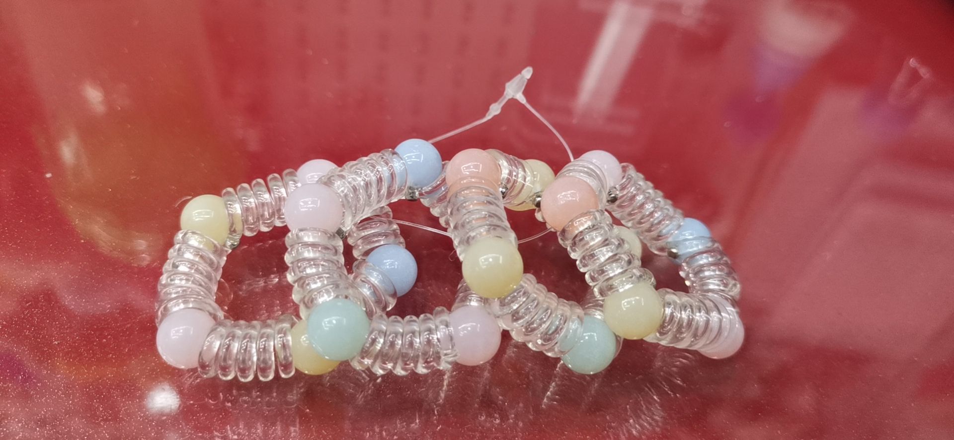 Five transparent jelly beads