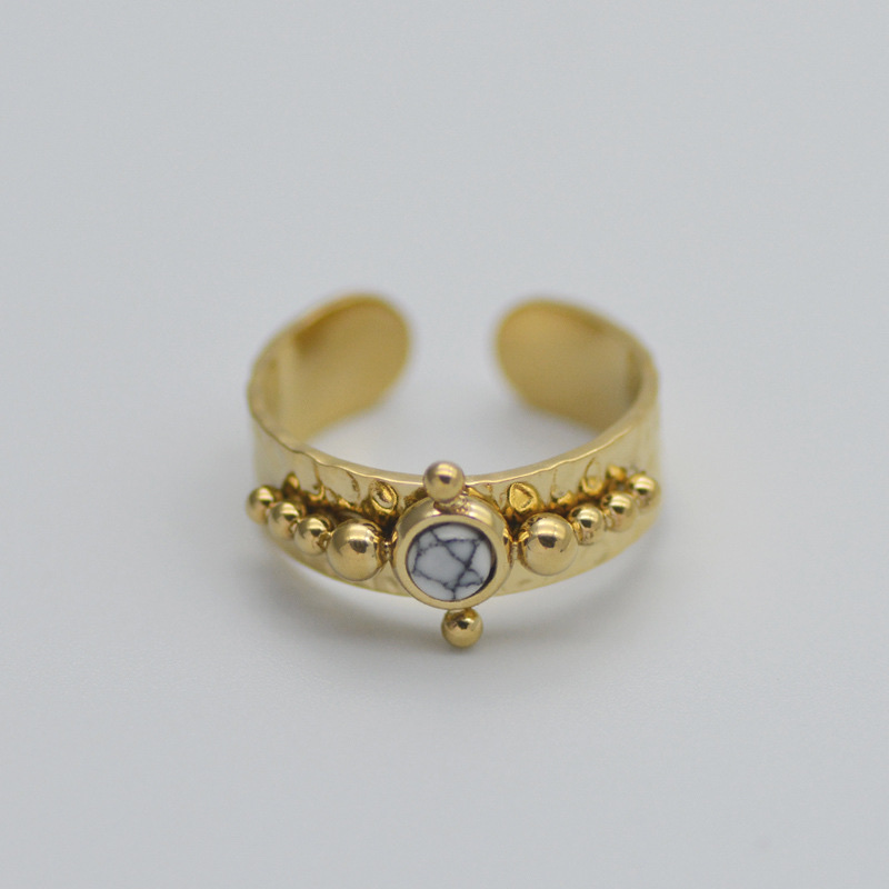 A French retro women's ring with a concave-convex texture, a stainless steel ring set with teardrop-shaped black turquoise and titanium steel plated with 14k gold details Picture