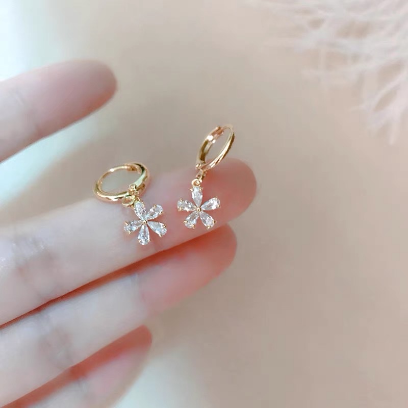 The sparkling and ethereal floral light luxury design of the perfect, fashionable and individual ear rings