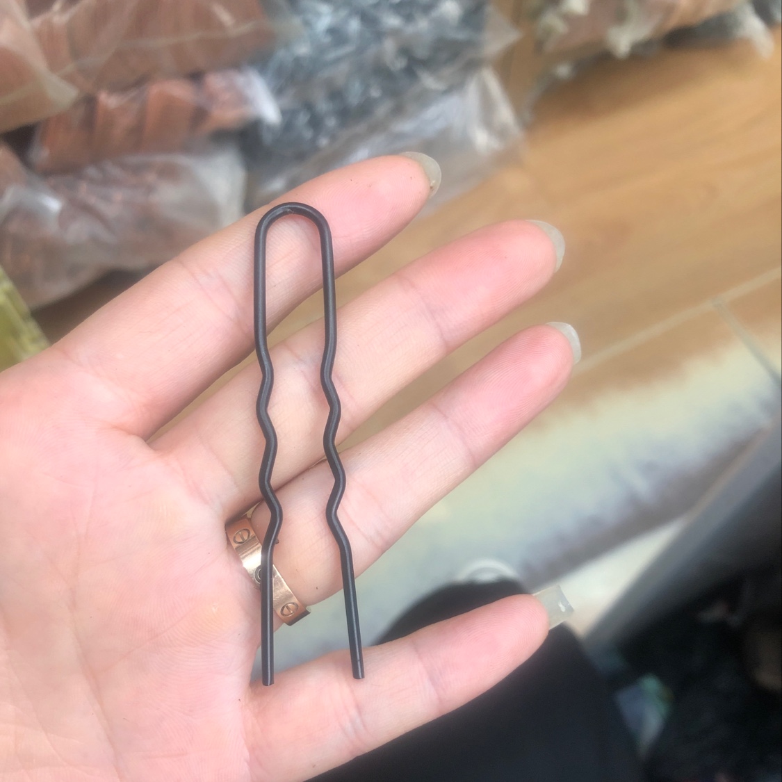 A two-pronged matte black fork
