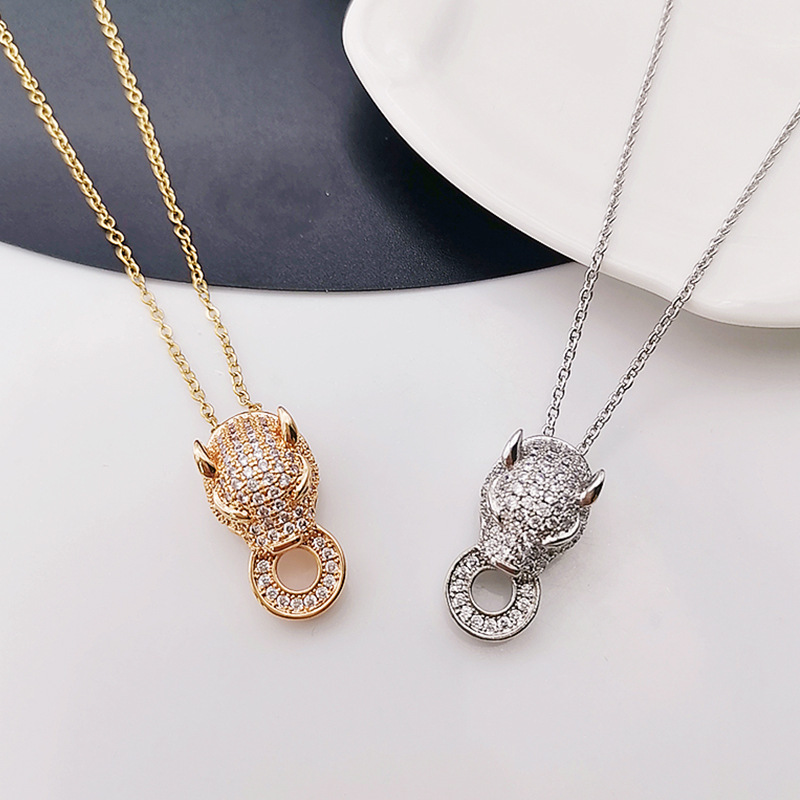 European and American fashion micro-inlaid leopard head bite ring necklace women's jewelry zircon pendant earrings factory direct sales