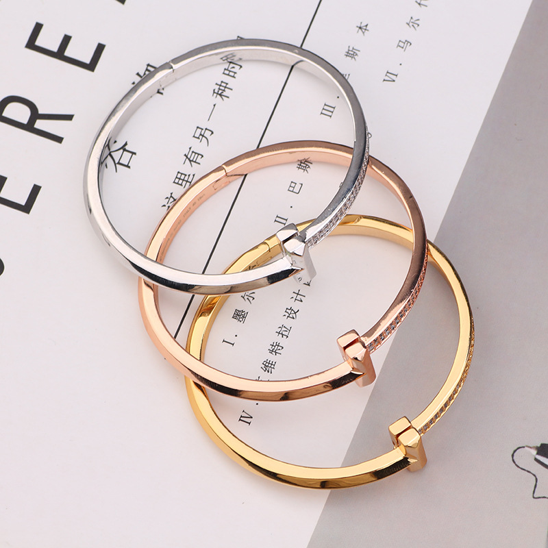 Creative gold-plated semi-inlaid double T bracelet, European and American fashion, versatile, light luxury women's style, slightly inlaid zircon wide version bracelet wholesale Item Picture