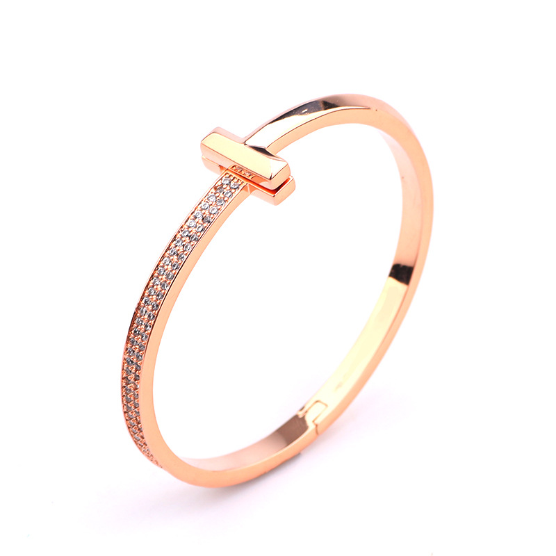 Creative gold-plated semi-inlaid double T bracelet, European and American fashion, versatile, light luxury women's style, slightly inlaid zircon wide version bracelet wholesale detail image 4