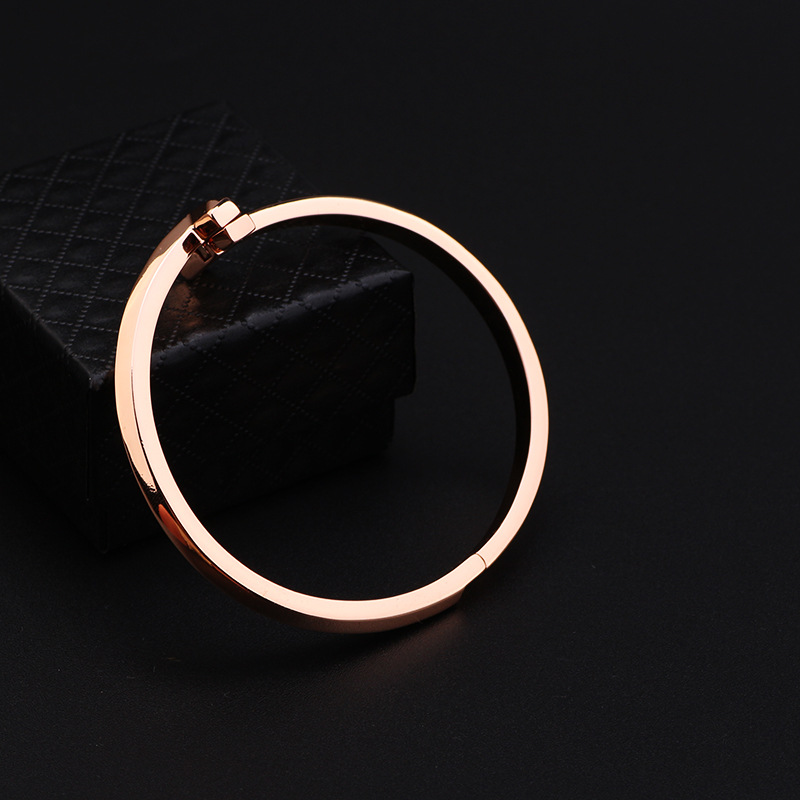 Creative gold-plated semi-inlaid double T bracelet, European and American fashion, versatile, light luxury women's style, slightly inlaid zircon wide version bracelet wholesale detail image 7