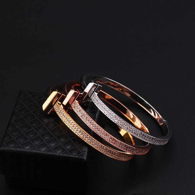 Creative gold-plated semi-inlaid double T bracelet, European and American fashion, versatile, light luxury women's style, slightly inlaid zircon wide version bracelet wholesale detail image 5