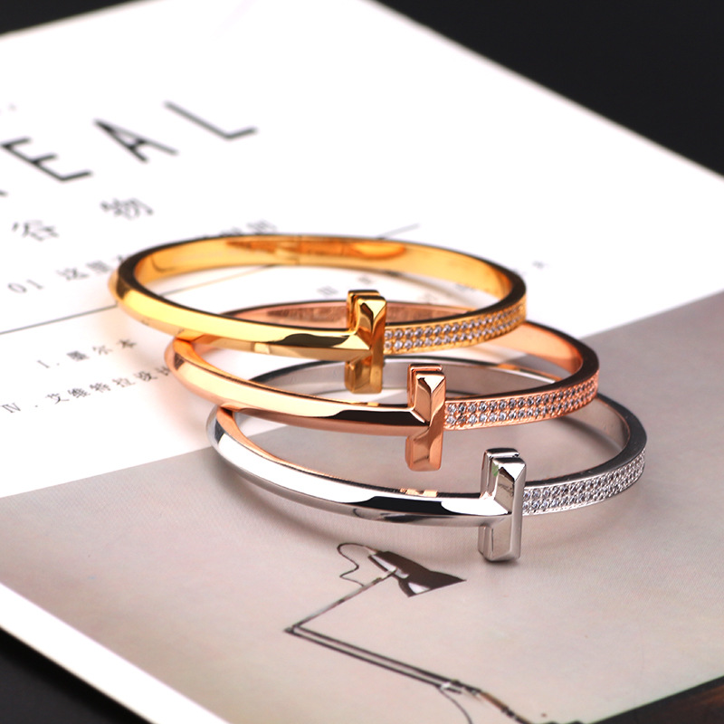 Creative gold-plated semi-inlaid double T bracelet, European and American fashion, versatile, light luxury women's style, slightly inlaid zircon wide version bracelet wholesale