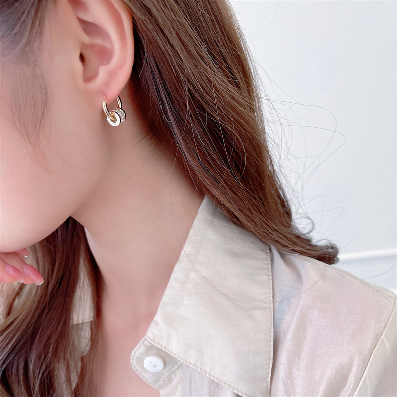New trendy and high-end earrings for women, small, simple and niche design sense, zircon dynamic rotating ring ear buckles detail image 4