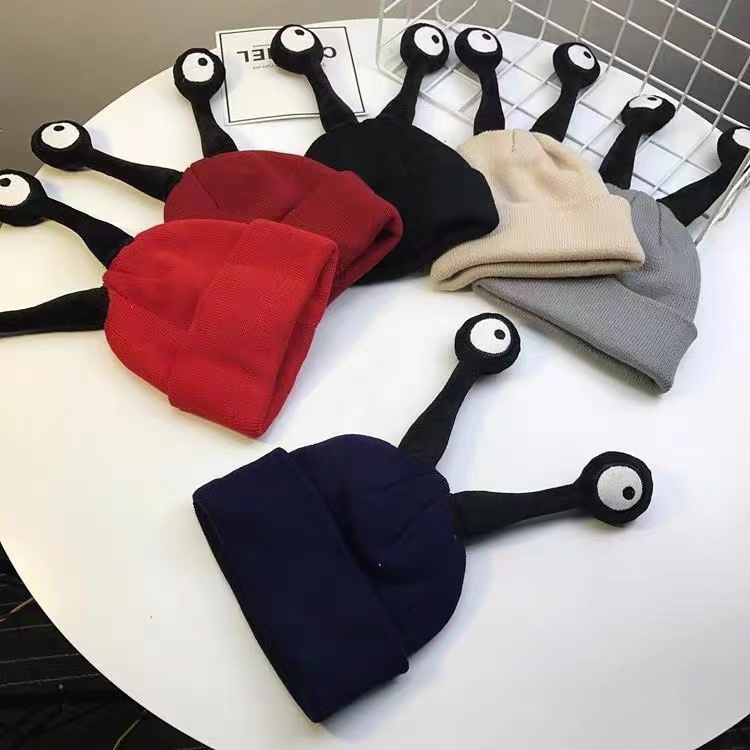Family hiking with children wearing insect caps