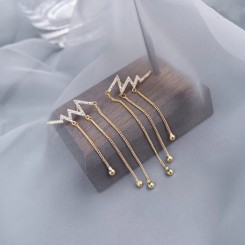 Heartbeat tassel earrings, a unique and stylish design for women, are simple and ethereal long stud earrings from Korea