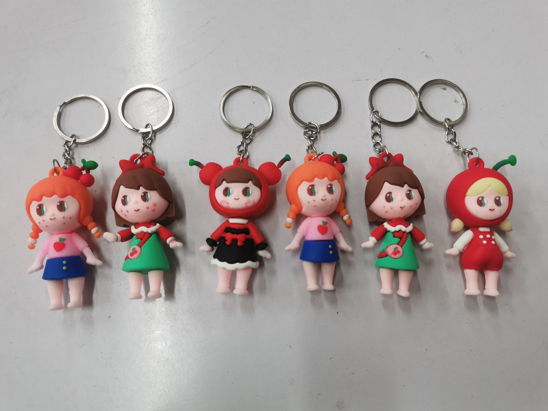 There are many mixed styles of Blue Goose Fruit Girl keychains. 73478292 details Picture