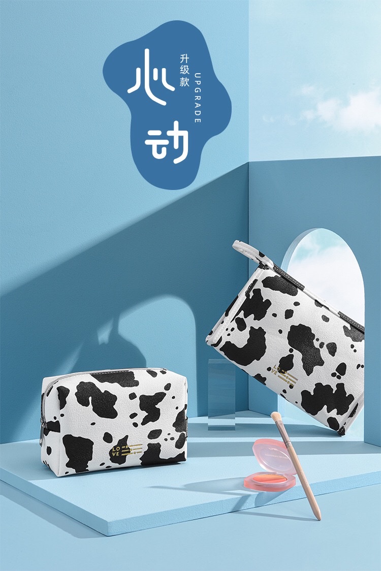 Waterproof PU cosmetic bag, InS-style cow print hand-held cosmetic bag, travel and outing milk print cosmetic storage bag Item Picture