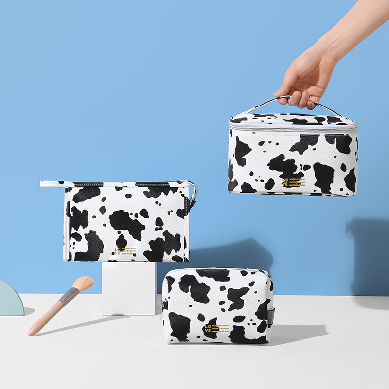 Waterproof PU cosmetic bag, InS-style cow print hand-held cosmetic bag, travel and outing milk print cosmetic storage bag