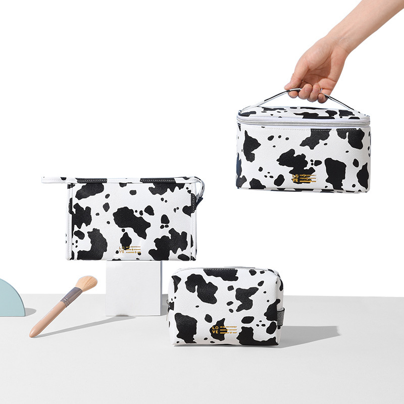 Waterproof PU cosmetic bag, InS-style cow print hand-held cosmetic bag, travel and outing milk print cosmetic storage bag Application Scenario