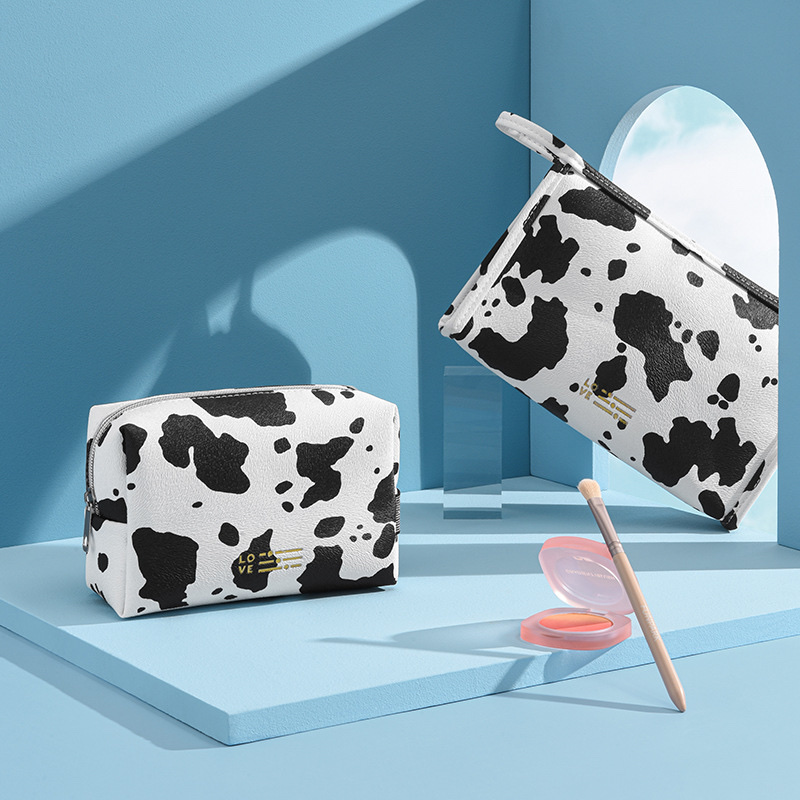 Waterproof PU cosmetic bag, InS-style cow print hand-held cosmetic bag, travel and outing milk print cosmetic storage bag Specification image
