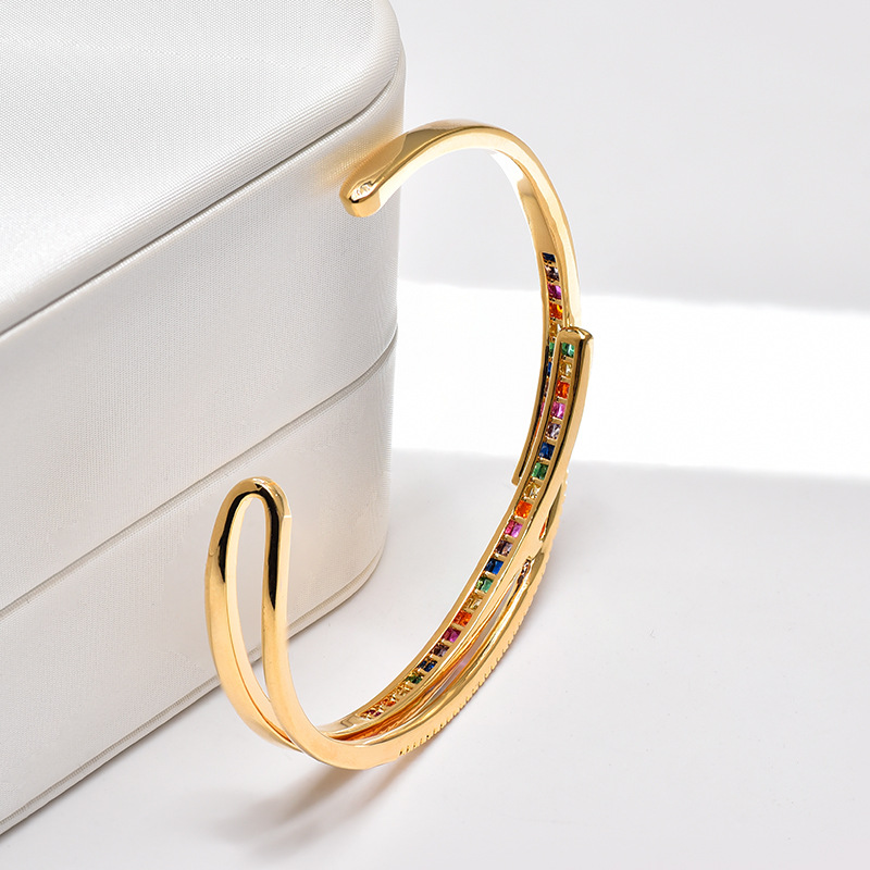 This unique European and American style bracelet with a hollowed-out design featuring colorful zircon and adjustable openings, is a popular gift for women detail image 4