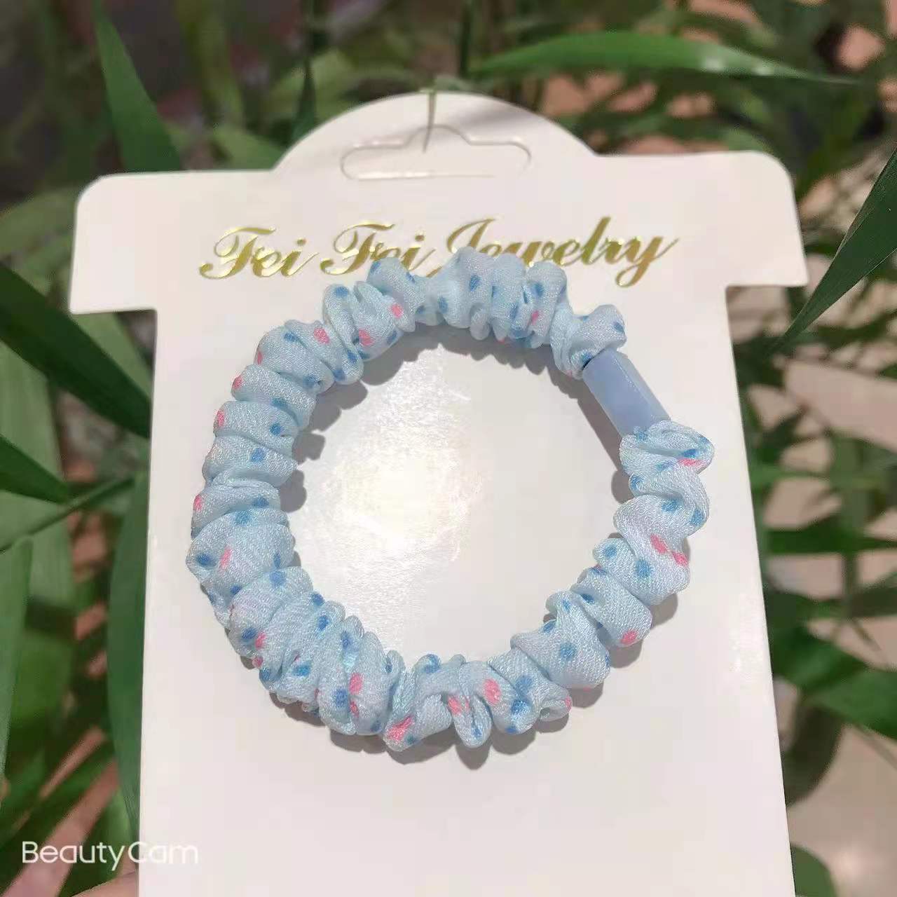 The new polka dot spring color leather band small intestine hair tie with pleats can be DIY. It's a hair tie for girls to tie a ponytail bun