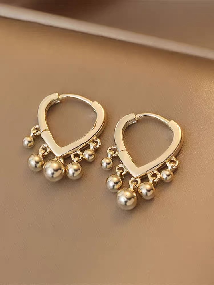 Simple pendiente de viento frío nuevo estilo marea pendientes mujer corazón hebillas cuentas de oro borlas pendientes details Picture