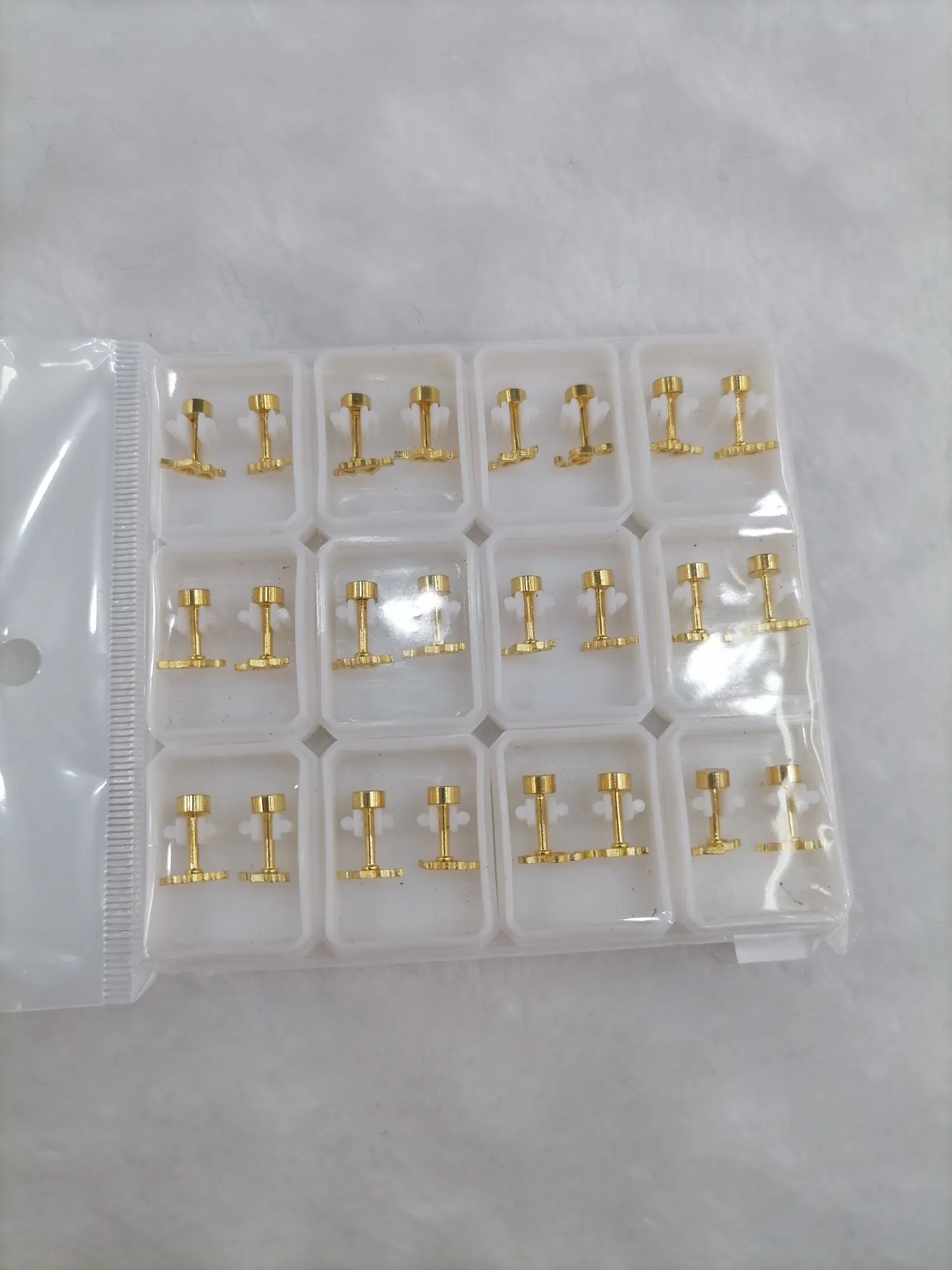 Titanium steel golden hollowed-out heart-shaped stud earrings detail image 2