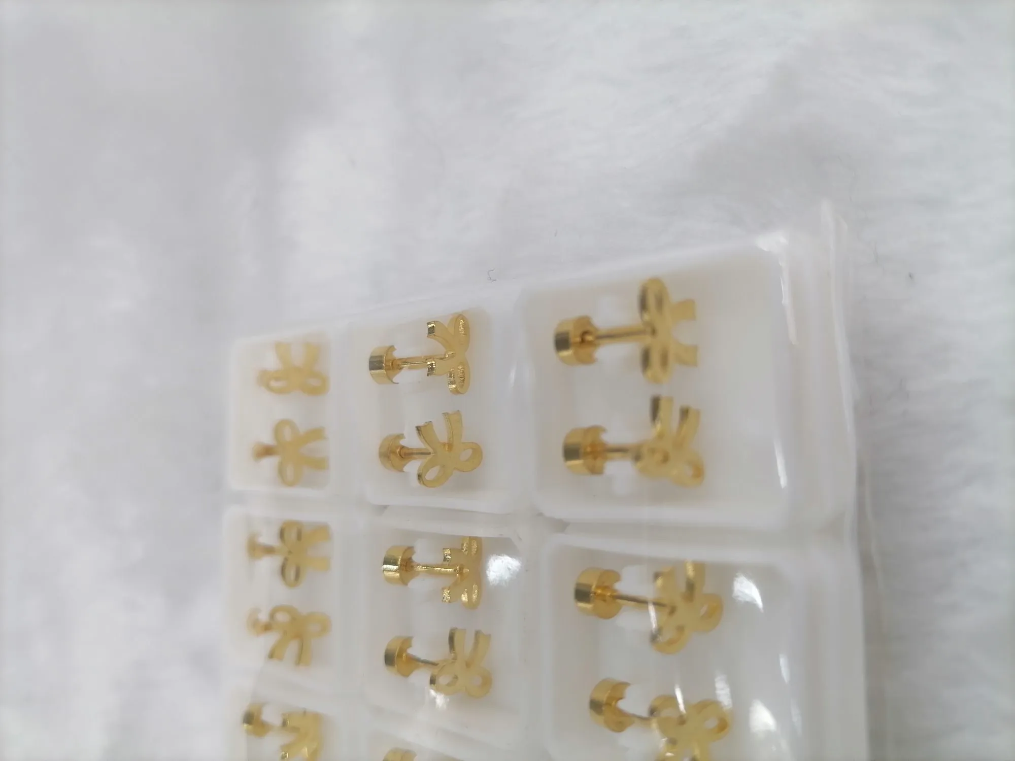 Titanium steel golden hollowed-out girl stud earrings detail image 3