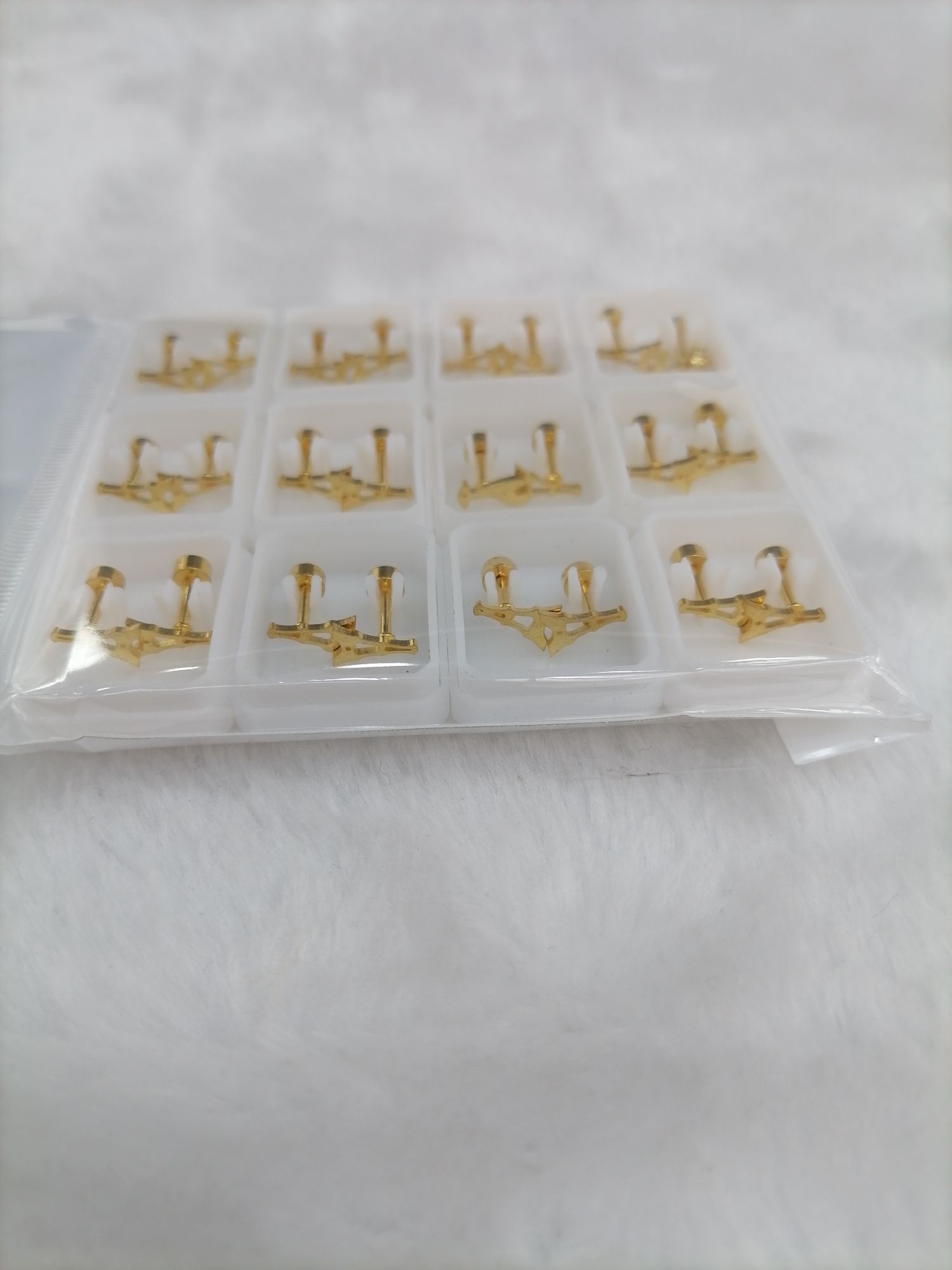 Titanium steel golden hollowed-out pyramid ear studs detail image 3