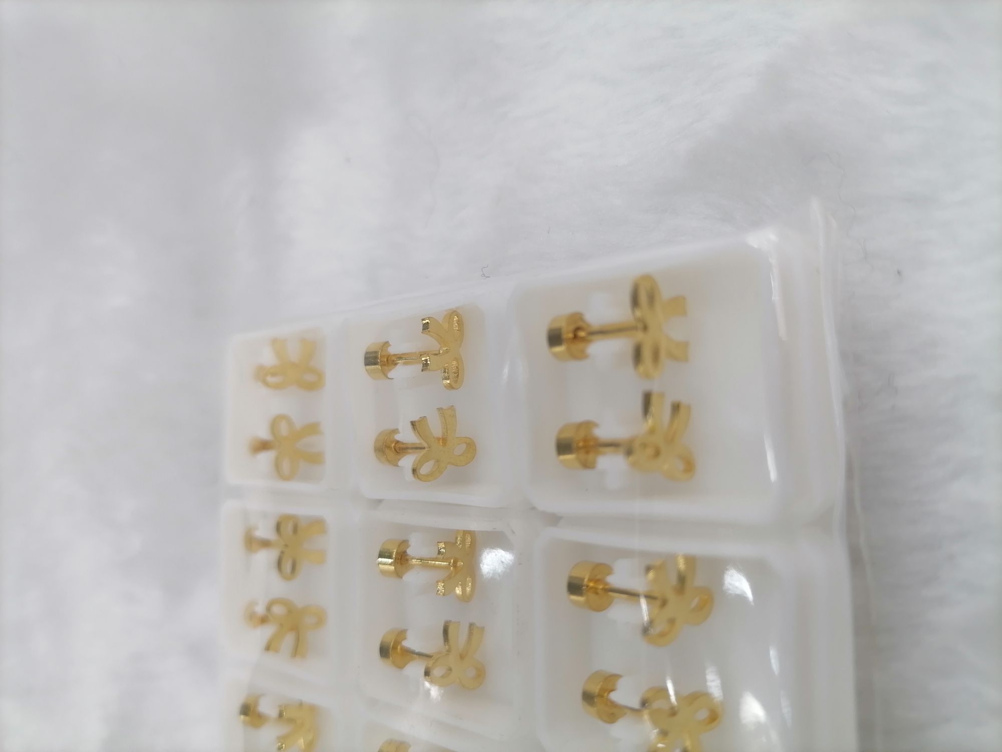 Titanium steel golden hollowed-out girl stud earrings