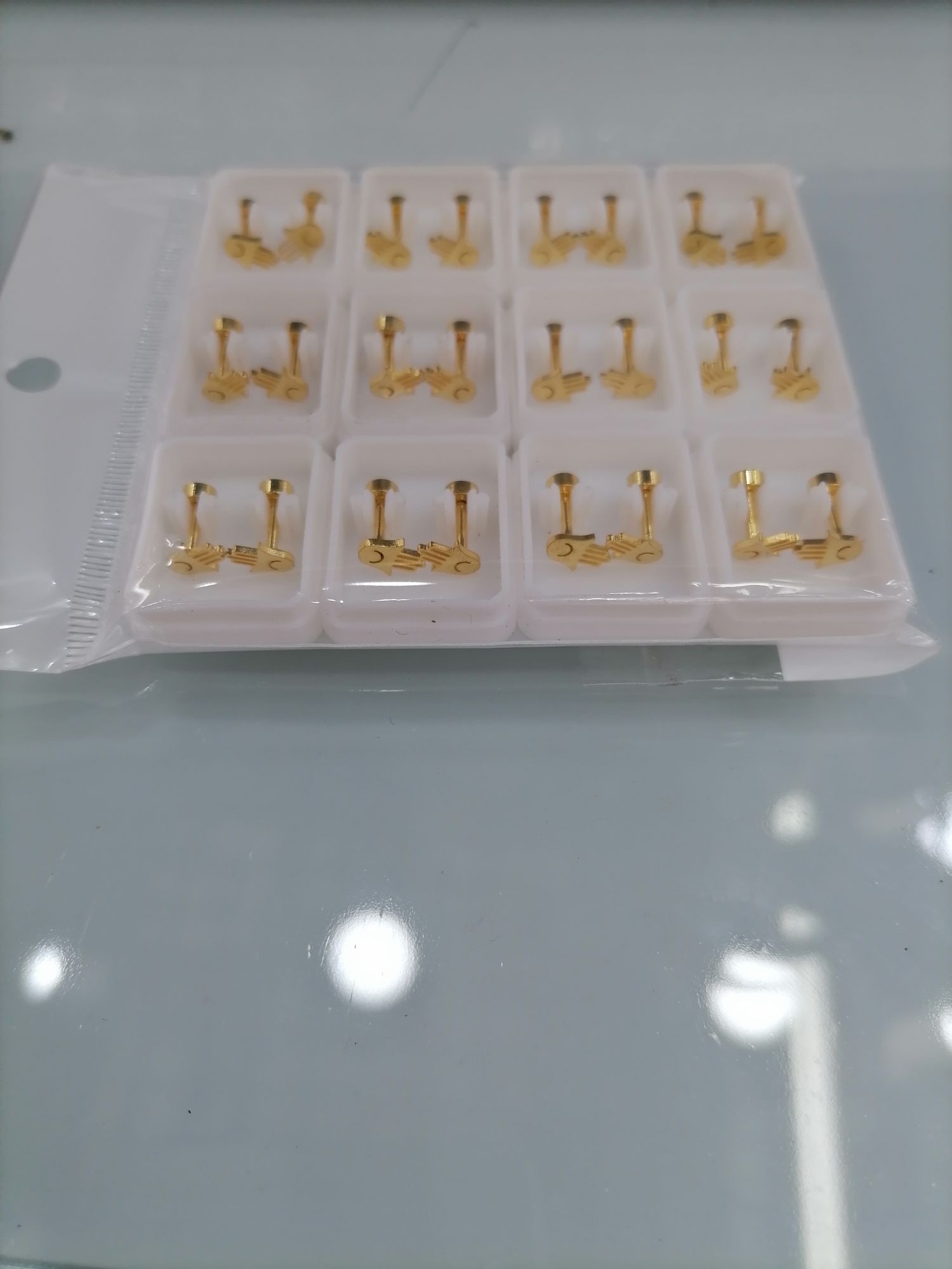 Titanium steel golden small hollowed-out ear studs details Picture