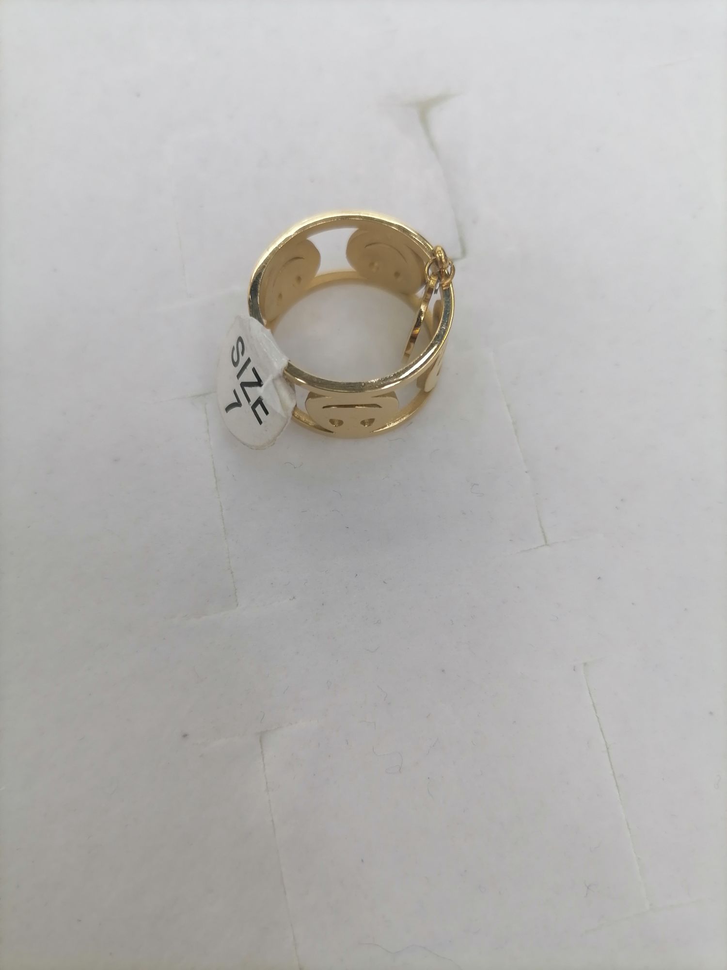 Titanium steel golden hollowed-out smiling face with luck pendant ring Specification image
