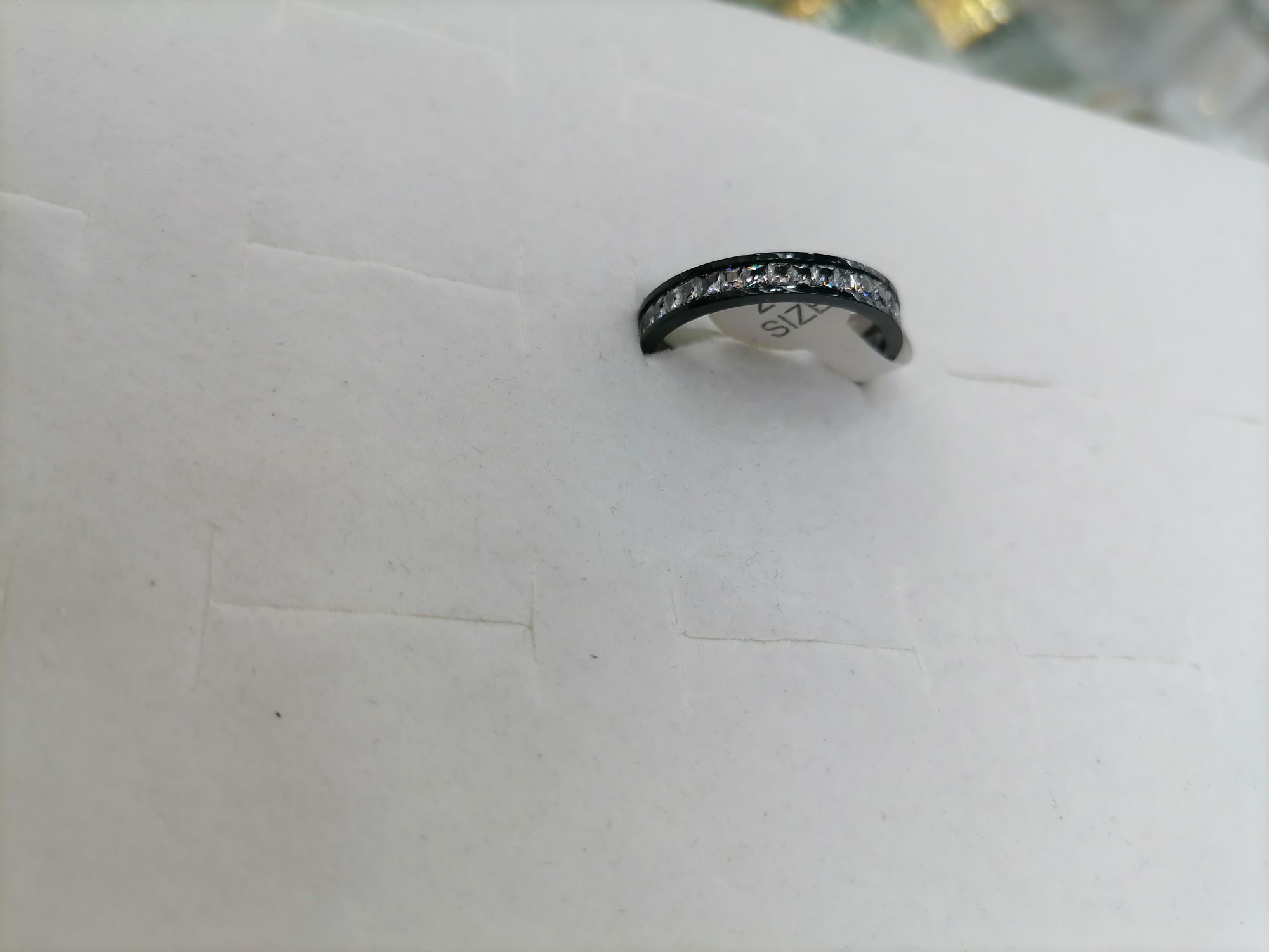 A black titanium steel ring with a row of diamonds detail image 2