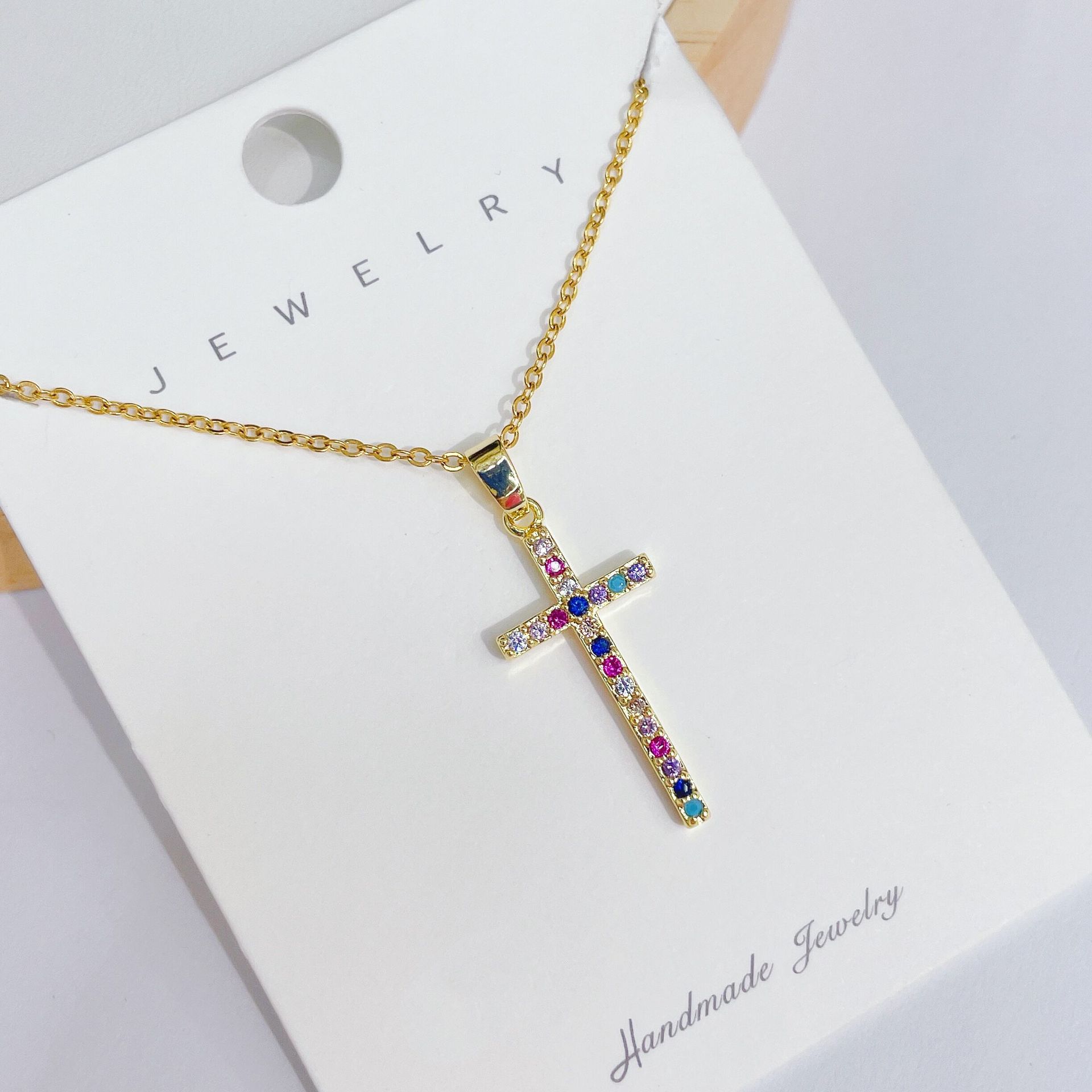 A new, simple and elegant design of a colorful cross necklace pendant with a unique and high-end collarbone chain for women details Picture