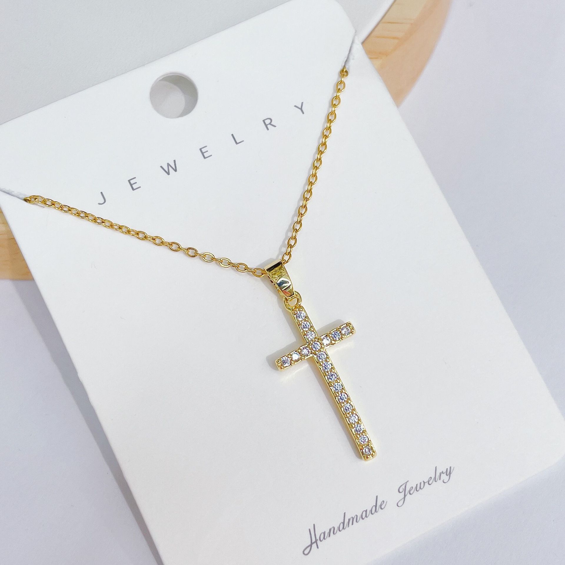 A new, simple and elegant design of a colorful cross necklace pendant with a unique and high-end collarbone chain for women Specification image
